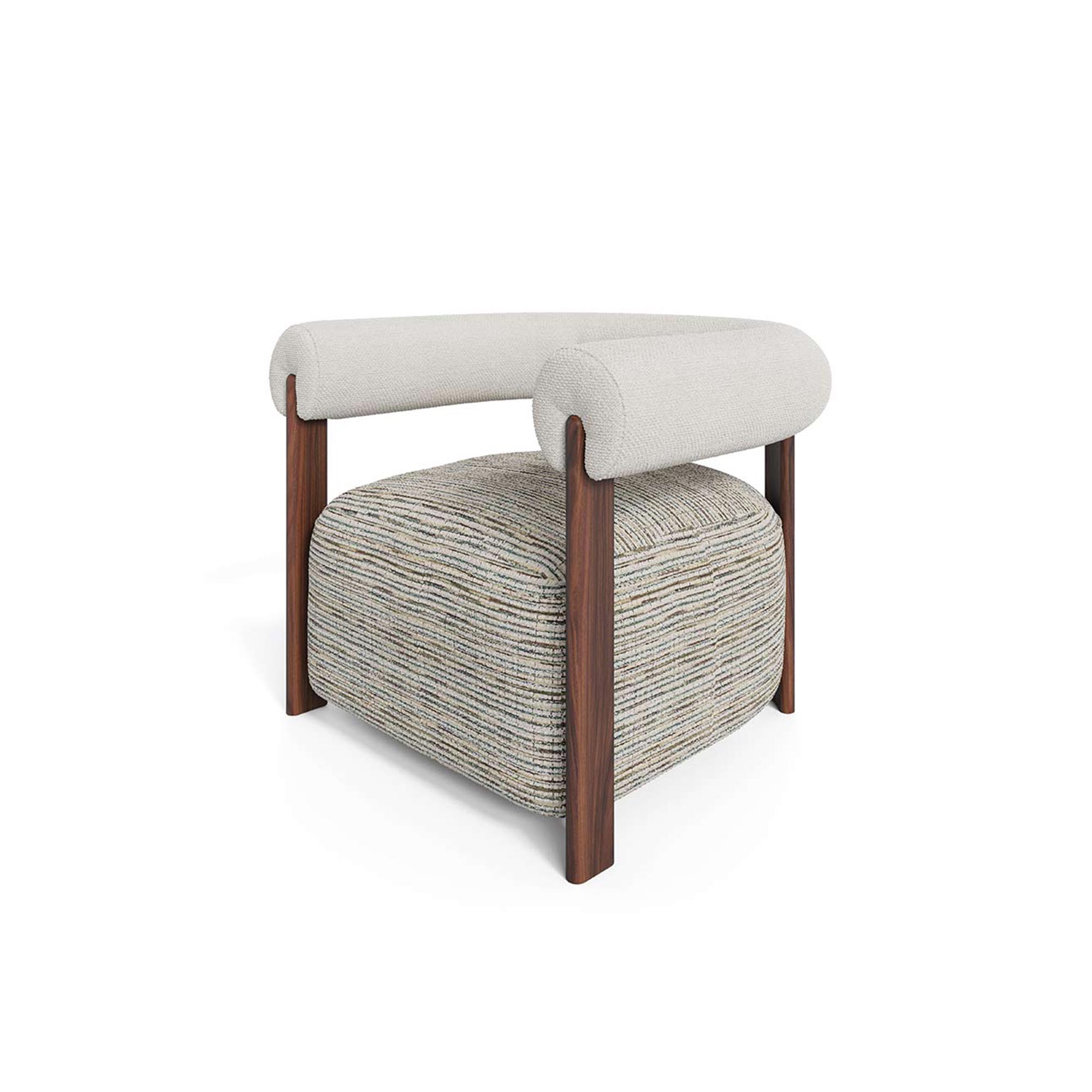 Claire Armchair Modern luxury armchair with rounded cushioned backrest, neutral upholstery, patterned fabric seat, and walnut legs, designed by Nolita Harbour. 45 degrees