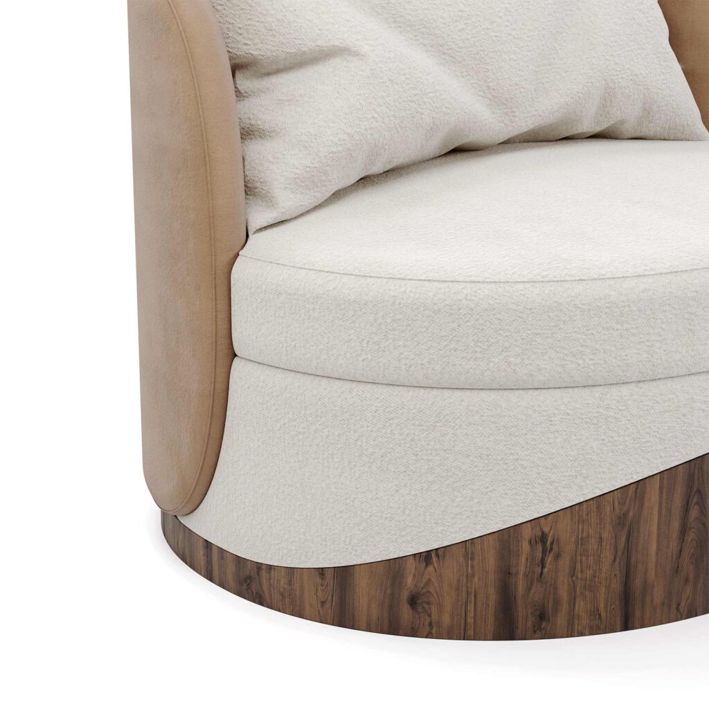Close-up of cream upholstered swivel chair with tan suede sides and curved wooden base detail on white background.