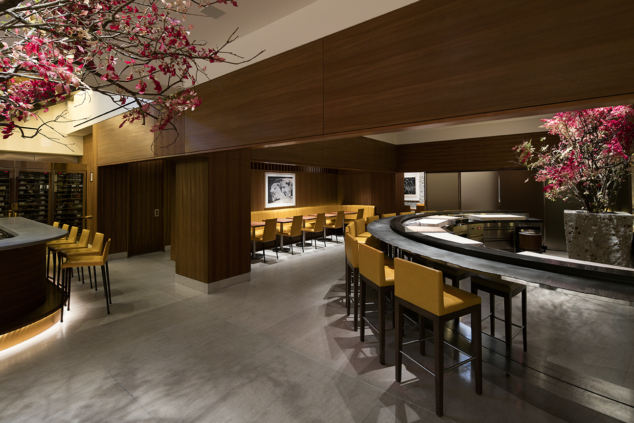 "Elegant waterfront dining area, offering a sophisticated yet relaxed ambiance with contemporary furnishings, warm ambient lighting, and an open-air design. The space provides stunning panoramic views of the marina, with plush seating and meticulously arranged tables that enhance the upscale dining experience. The combination of modern aesthetics and a serene coastal backdrop makes it an ideal destination for a luxurious and memorable meal." - Nolita Harbour