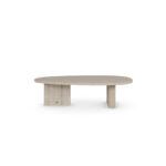 Oval travertine coffee table with two vertical slab legs and subtle brass accents, Landi by Nolita Harbour.