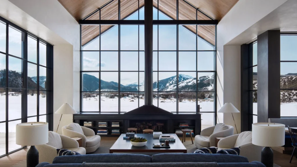 Aspen luxury homes showcasing refined mountain home interior design and seasonal residence furnishing, featuring contemporary alpine architecture, natural wood and stone materials, panoramic mountain views, elegant living rooms with fireplaces, and seamless indoor-outdoor living in Colorado.