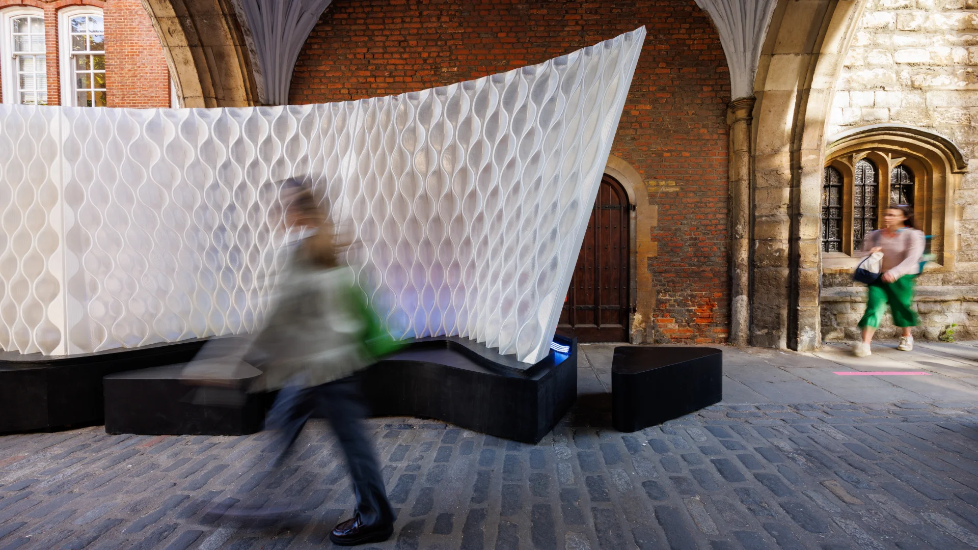 Clerkenwell Design Week exhibition showcasing compact living solutions and refined small apartment design, featuring transformable interiors, bespoke built-in storage, modular furniture systems, and contemporary urban London architecture in elegant 16:9 compositions.