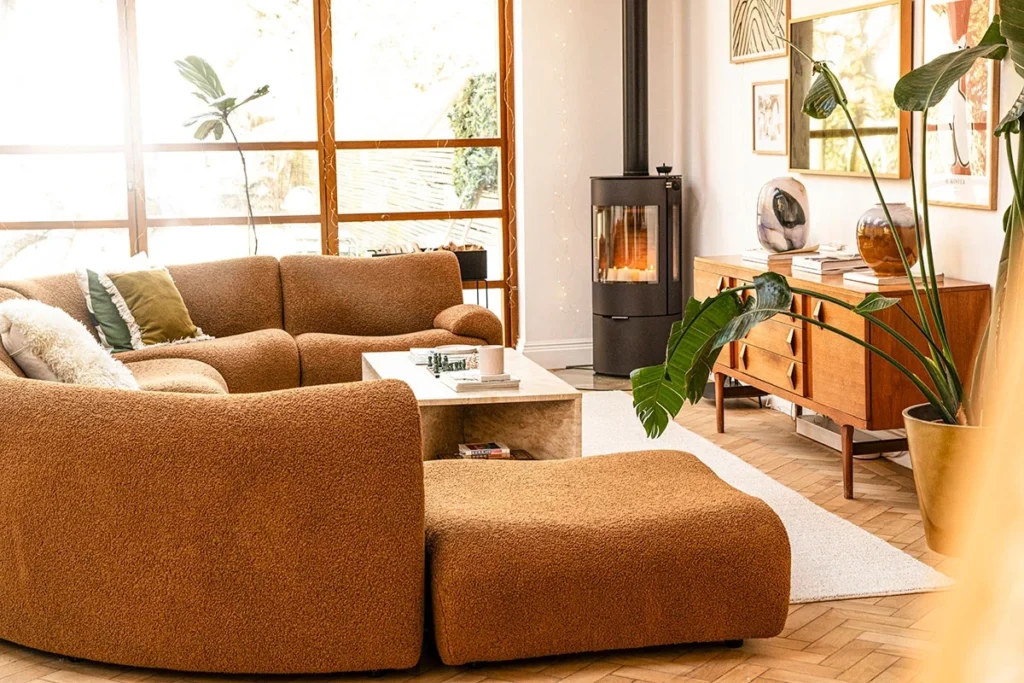 Modern living space softened by mid-century and vintage furniture elements, demonstrating a balanced mix of antique furniture and contemporary comfort