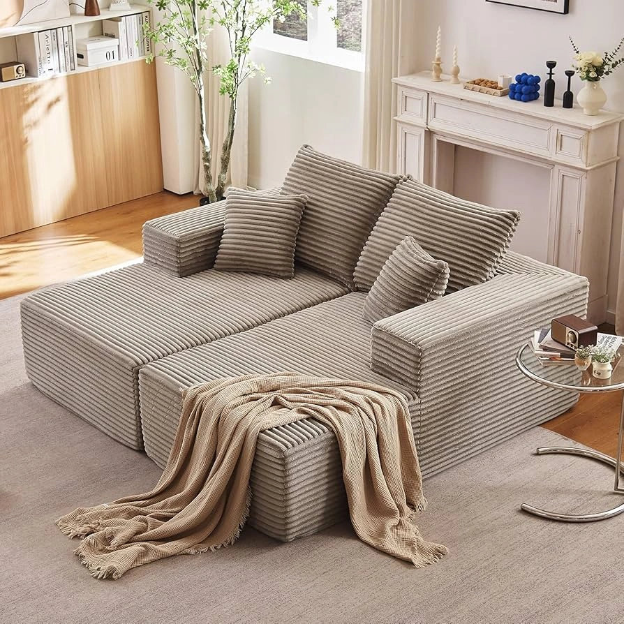 Luxury living room interiors featuring modular sectional sofas with corner modules and chaise lounge units, styled with statement ottomans, layered textiles, and contemporary décor in refined, light-filled residential settings.