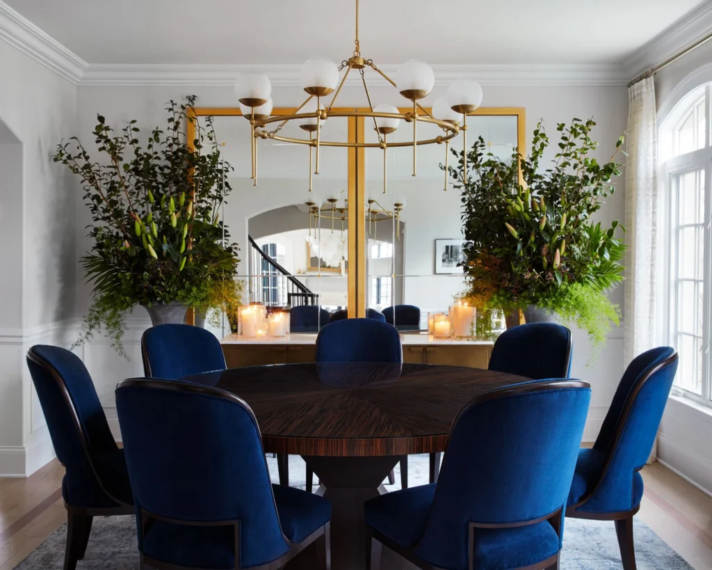 Elegant contemporary dining interiors featuring upholstered dining chairs in neutral and deep tones, sculptural wooden and marble tables, refined lighting, and layered textures that highlight comfort, craftsmanship, and luxury design.