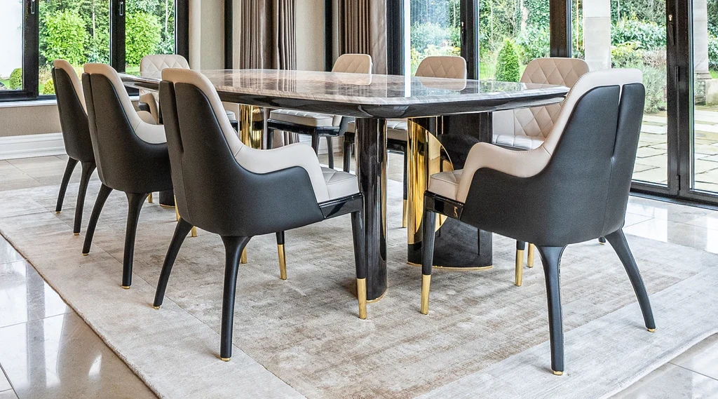 Elegant contemporary dining interiors featuring upholstered dining chairs in neutral and deep tones, sculptural wooden and marble tables, refined lighting, and layered textures that highlight comfort, craftsmanship, and luxury design.