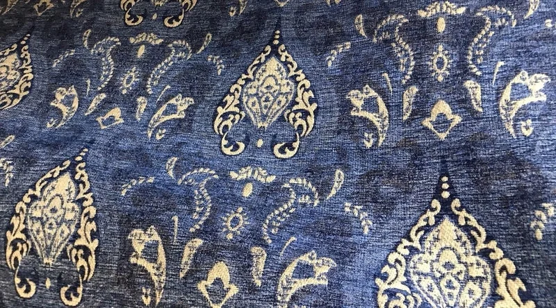 Close-up of patterned blue velvet upholstery fabric showcasing artisanal texture and decorative motif, illustrating refined velvet upholstery care in luxury interiors.