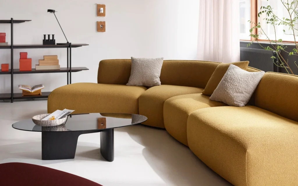 Luxury modular sofas showcased in refined contemporary living rooms, from expansive alpine-view interiors and warm chalet-style lounges to minimalist urban spaces, highlighting contemporary sofa design, flexible seating solutions, premium materials, and modern living room elegance in 2026.